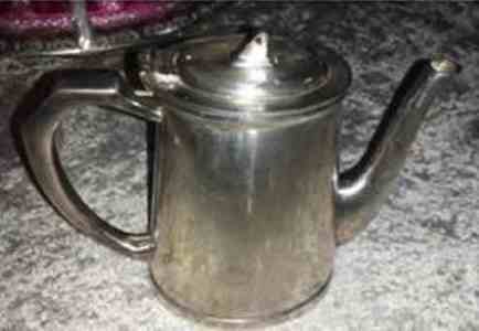 broad arrow on a teapot