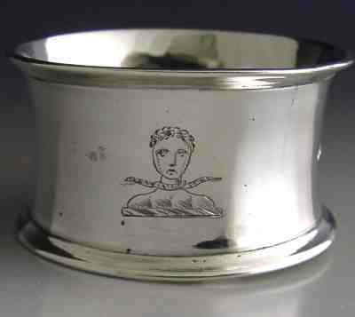silver napkin ring with family crest: VAUGHAN
