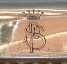 Noble's coronet and PS monogram