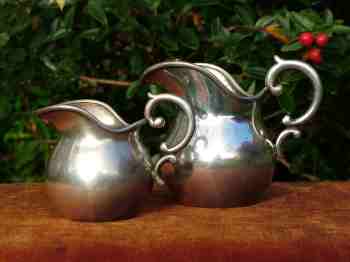 A pair of milk-pots made by Norblin in the beginning of XX century