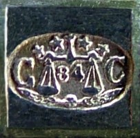 The 'CC' oval mark in a square box, used between 1877 and 1899